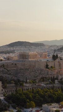 Acropolis of Athens ancient Greek culture Parthenon at sunrise Greece aerial vertical video