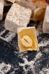 soft and fresh Turkish delight sprinkled with powdered white sugar, diced sweet white soft Turkish delight slices with nuts and dried fruits