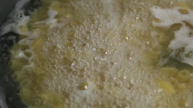 boil macaroni pasta in boiling water