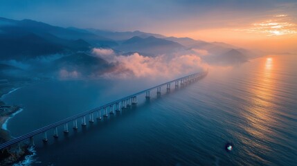 Fototapeta premium Haishang highway bridge stretching across the sea in a dramatic aerial view with soft morning mist.