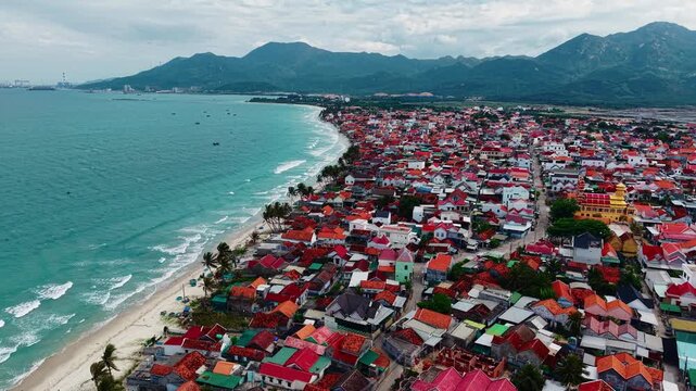 Coastal Doc Let village in vietnam with red roofs overlooking the ocean.