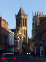 Naklejka premium Blurred York church street at sunset England
