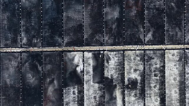 Aerial top view of traditional salt mining fields industry in Vietnam.