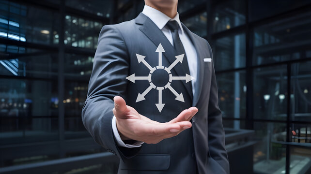 Businessman showing a radial diagram with multiple arrows pointing outwards Business picture