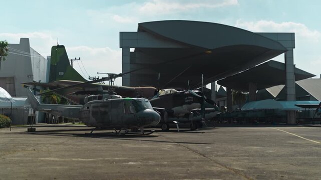  An old aluminum helicopter stands outside with engines muffled. Retro aviation.