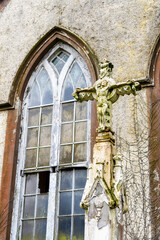 Obraz premium Crucifix outside a derelict Roman Catholic church