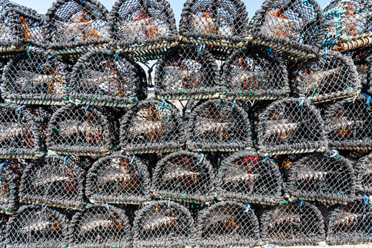 Lobster cages stacked up at Howth Harbour, Dublin, Ireland.