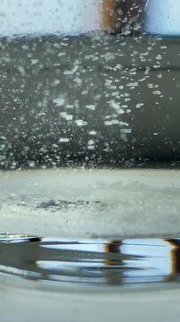 Epsom salt. Salt. Glass. Glass of water. Epsom salt. Slow motion video. High quality 4k footage