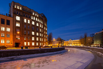 Griboyedov Canal, Saint Petersburg, Russia. Evening cityscape. Winter view of the frozen canal in the historic center of Saint Petersburg.