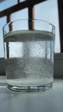 Epsom salt. Salt. Glass. Glass of water. Epsom salt. Slow motion video. High quality 4k footage