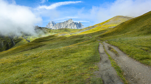 The Tour du Mont Blanc crosses France, Italy, and Switzerland, offering breathtaking views of glaciers, alpine passes, and the highest peak in the Alps.