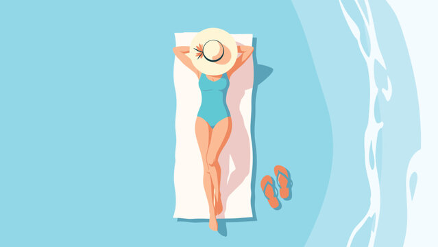 Top-down view of a woman wearing a blue swimsuit and a large sun hat sunbathing on a white towel on a beach next to the ocean.