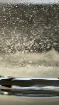 Epsom salt. Salt. Glass. Bath. Bath salt.Glass of water. Epsom salt. Slow motion video. High quality 4k footage