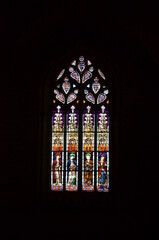 Seville, Spain 03.24.2019: Stained glass window in the Chapel of San Laureano of the Seville Cathedral