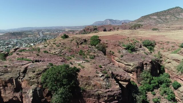 Aerial Drone Shot Transitioning from May Lomin Cliffs to Abyi Adi Town, Tigray, Ethiopia
