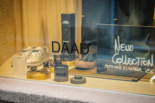 Milan, Italy - 2026, 17 Feb: DAAD SS26 window display featuring luxury footwear, chic accessories, and elegant packaging in a modern boutique setting