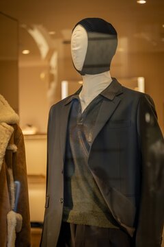 Milan, Italy - 2026, 17 Feb: Maison Margiela SS26 display featuring a tailored suit, layered textures, and modern minimalist style in a luxury boutique setting