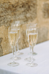 glasses of champagne on a table during a wedding celebration 