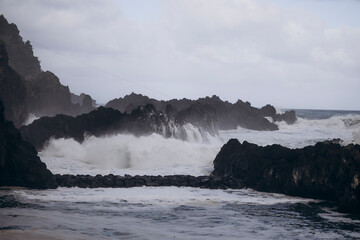 incredible views of the mountains and the ocean, splashes of water and the sound of waves