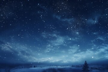 Fototapeta premium Dark blue winter night sky with countless twinkling stars over a snow covered landscape