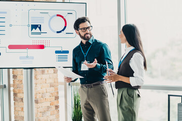 Business discussion in a modern loft conference room with a digital presentation