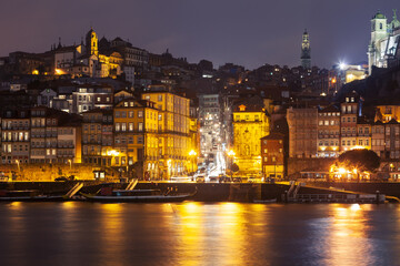 Night cityscape with reflection of the lights in water