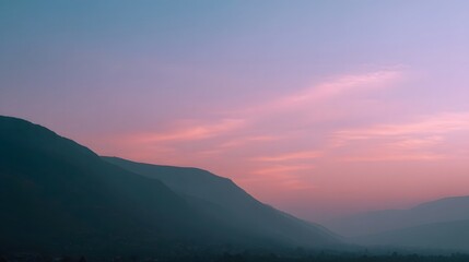 A breathtaking vista of a serene mountain valley bathed in the soft pastel hues of a twilight sky painted with pink purple and blue light