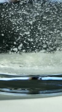 Impurities in water. Particles in water. Epsom salts. Slow motion video. High quality FullHD footage