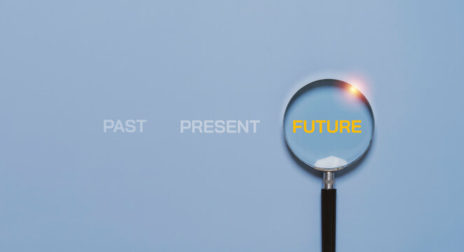 Magnifying glass focusing on future word over past and present symbolizing vision, strategic planning, business forecasting, goal setting, positive mindset and long term success concept.