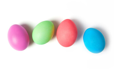 Colorful pastel easter eggs arranged diagonally on white background