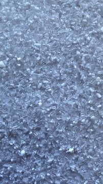 Epsom salt crystals.Scattered salt. Crystals. Epsom salt crystals. White particles. Slow motion video. High quality 4k footage