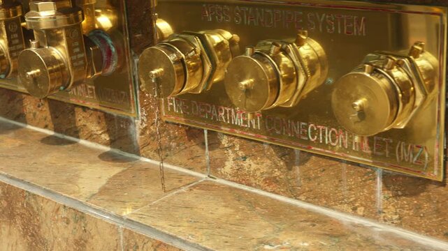 Detailed connection examination, careful inspection of wallmounted brass connection assembly parts for safety, systematic evaluation of recessed brass fittings in wall for operational integrity