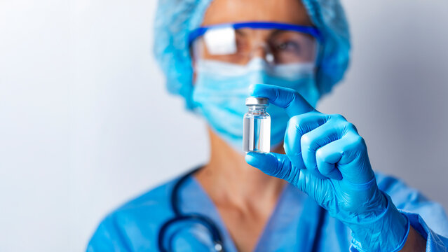 Healthcare Professional Holding a Vaccine Vial