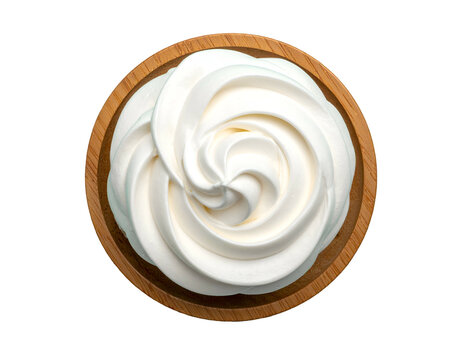 Creamy white swirls in a wooden bowl, a smooth, rich texture