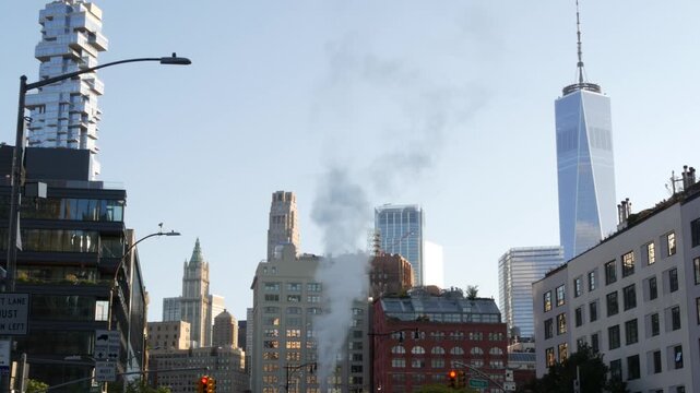 New York City Manhattan Downtown Financial District, United States of America. World Trade Center skyscraper, FiDi tower building. Modern business center. Hot steam smoke vapor. Varick street, Tribeca