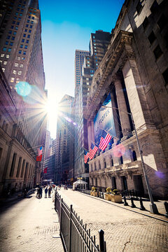 Scenic view of the NYSE on Wall Street, the heart of Lower Manhattan's Financial District, in New York City, NY, USA, on a sunny but cold winter day