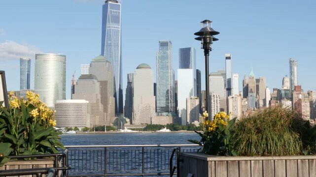New York City Manhattan downtown financial district skyline, New Jersey Exchange Place, United States. Urban cityscape with skyscraper buildings, World Trade Center. J Owen Grundy park, Paulus Hook.