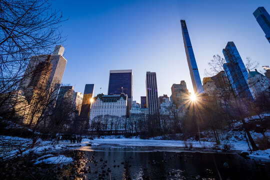 Stunning view of the Plaza Hotel within the impressive Billionaires' Row of pencil towers in Central Park in New York City, USA, on a cold winter day