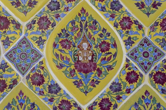 Coloured Bencharong ceramic tiles, depiction of Thai angels (devas) in diamond-shaped frames, circular gallery (Phra Rabieng) around the central chedi, Wat Ratchabophit (full name Wat Ratchabophit Sathit-Mahasimaram Ratcha Wora Maha Viharn), Buddhist temple, Wat, Phra Nakhon district, Bangkok, Thailand