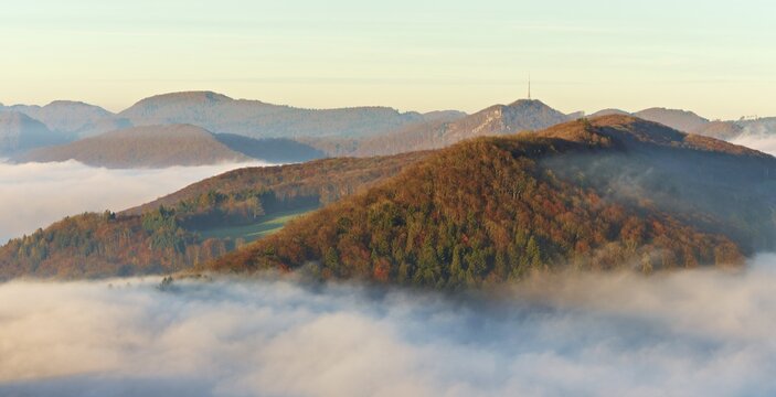 View from the Gisliflue of the Jurassic foothills covered in fog with the water fluh in the morning light, Talheim, Canton, Aargau, Switzerland