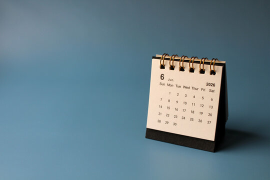 Monthly calendar template for the new year 2026 desk calendar,isolated on blue background.