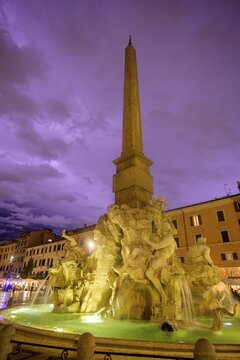 Four-flow fountain in Piazza Navona during a thunderstorm, Rome, Italy