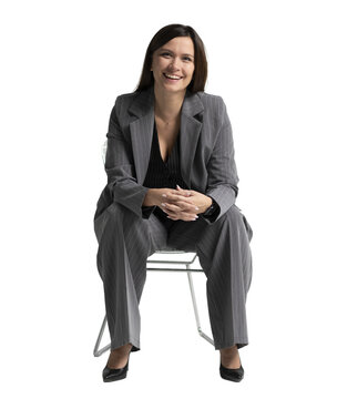 Portrait of a cheerful young businesswoman sitting in a chair against transparent background. Full body
