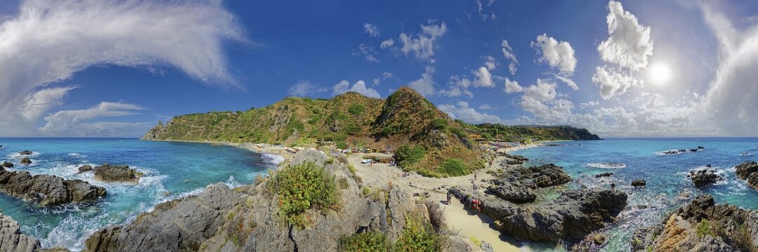 360&deg; panorama on the sandy beach Capo Vaticano and bay with turquoise sea and bizarre sky, Capo Vaticano, Calabria, Italy