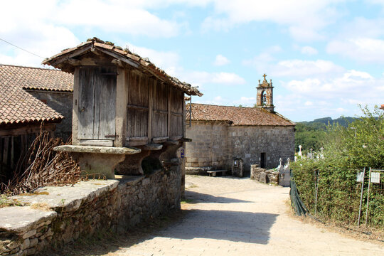 Iglesia de San Xiao do Camino and cross on the road in O Coton Palas de Rei July 2024