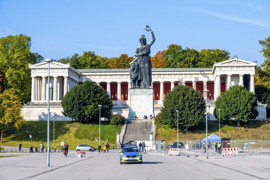 Police car in front of the Bavaria statue at Theresienwiese, Munich, Bavaria, Germany