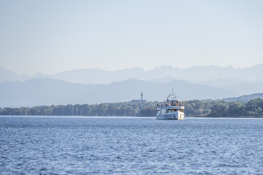 Ferry on the lake, behind Geistliches Zentrum Kloster St. Josef, Lake Ammer, Upper Bavaria, Germany