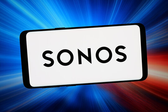 Stuttgart, Germany - 02-20-2026: In this photo illustration, the logo of US audio equipment company Sonos Inc. is displayed on a smartphone in front of abstract background on computer screen.