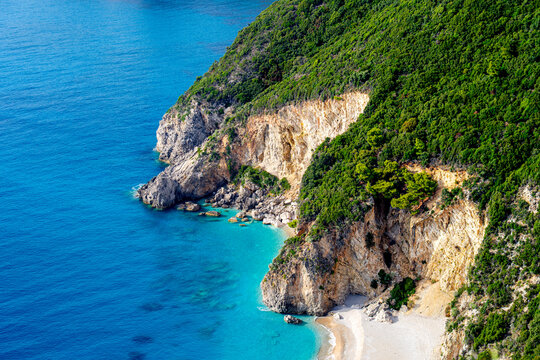 Turquoise water Ionian Sea on coast Greece, sea cliffs on holiday island Corfu on sunny summer day, Stelari Beach.