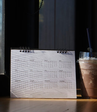 Calendar desk placed on business table. Desktop Calender for Planner to plan agenda, timetable, appointment, organization, management each date, month, and year-Calendar 2026 Concept-vertical image.